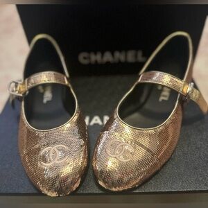 Chanel Gold Women's Shoes

Chanel Gold Mary Jane Flats 36.5 RARE!! 25S BNIB